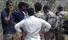 At least 20 killed as police open fire on smugglers in Andhra.