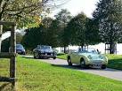 A classic Frogeye Sprite leads - via Daymix