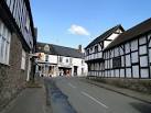 Red Lion on the left; on the right the former art shop/tea room is empty, - via Daymix
