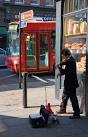 A violinist plays a sweet refrain on Flask Walk as a 268 bus drifts down - via Daymix