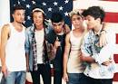 What the new One Direction press shot tells us about the bands.
