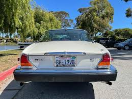 Image result for Nimbus White 1987 Jaguar