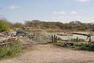 SU5715 : Quantity of junk plus a duck pond, Gravel Hill, Swanmore - via Daymix