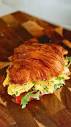 Scrambled egg croissant sandwich: a creamy mix of eggs and creme ...