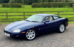 Image result for Dark Blue 1965 Jaguar