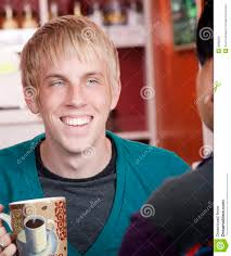 Man in coffee house with male friend - man-coffee-house-male-friend-9260809