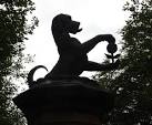 Dog and Pomegranate sculpture. On the gate posts of the entrance way to - via Daymix