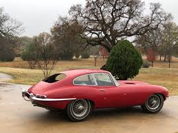 Image result for Maroon 1962 Jaguar