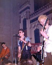 Clive Arnold Simon Justice Phil Lovering (TAFF) Neil Mackie. LATER Clive Arnold Kevin Mills Chris Bostock Neil Mackie. Clash influenced punk rockers. - X-Certs-001