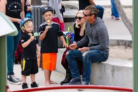 Image result for Queen B by Bumbleride $428 Gwen Stefani and Gavin Rossdale with Kingston and Zuma at the LA zoo