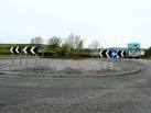 A traffic roundabout with a large ornamental plant as decoration. - via Daymix