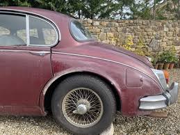 Image result for Maroon 1962 Jaguar