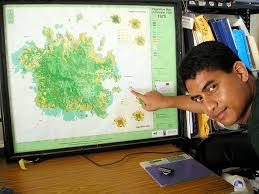 Conservation Society of Pohnpei official Ben Namakin points to the location of an islet that has disappeared and another that has been split due to rising ... - art5x