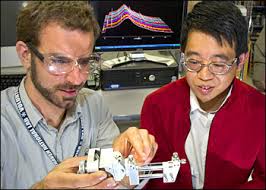 Jason Graetz and Jiajun Chen. Jason Graetz, left, and Jiajun Chen at NSLS beamline X14 A. A team of Brookhaven researchers has fabricated a new transparent ... - d1620911-graetz-chen-350px