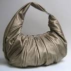 http://blog.mimiboutique.com/wp-content/uploads/2009/10/colette_shoulder_bag_gold6.jpg