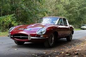 Image result for Maroon 1962 Jaguar