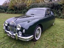 Image result for Dark Green 1959 Jaguar