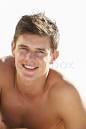 Boy Sitting On Beach'