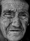 An old woman, her faced mapped