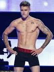 Justin Bieber strips down to his underwear at Fashion Rocks show.