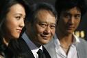 Ang Lee (C) poses with cast