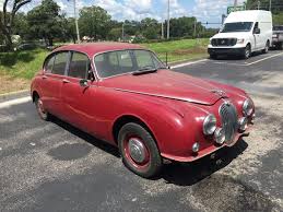 Image result for Maroon 1962 Jaguar
