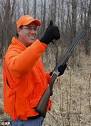 Republican candidate Rick Santorum, complete with NRA baseball cap ...