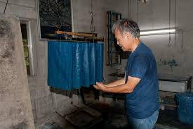 True blue: Indigo-dyed fabrics are hung inside Masanao Shiroma\u0026#39;s workshop. - fs20111101a3c