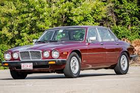 Image result for Sebring Red 1986 Jaguar