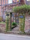 There is a sign on the gate saying "Welcome to the haunted house" SO7680 - via Daymix