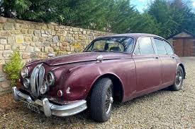 Image result for Maroon 1962 Jaguar