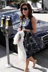http://thelatestcelebrityfashiontrends.com/wp-content/uploads/2009/12/Eva-Longoria-With-A-Coach-Handbag.jpg