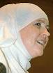 Muslim woman carries on work
