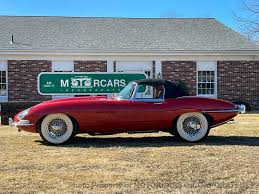 Image result for Maroon 1962 Jaguar