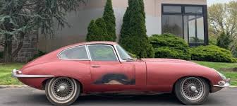 Image result for Maroon 1962 Jaguar