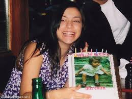 The final family photo: Meredith Kercher, in a picture taken by her father John, celebrates her 21st birthday with a cake bearing an image of her as a ... - article-2129717-1297BBDF000005DC-830_634x475