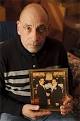 Michael Guido holds photo of himself with his brother at home in Brooklyn - michael-guido1