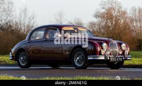 Image result for Maroon 1962 Jaguar