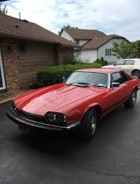 Image result for Sebring Red 1986 Jaguar