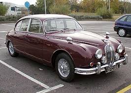 Image result for Maroon 1962 Jaguar