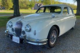Image result for Silver Blue 1959 Jaguar