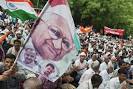 By Prasenjit Bhattacharya. Reuters: A supporter waved a flag with a portrait ... - OB-TW911_ihazar_G_20120725064254