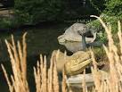 A close-up of some of the original 19th century dinosaur sculptures in - via Daymix
