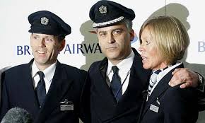 Senior first officer John Coward, pilot Peter Burkill and cabin services director Sharon Eaton-Mercer after the Heathrow crash-landing. - coward34