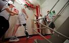 Thinking his way to the top: Amputee uses thought-controlled ...
