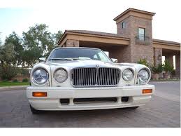 Image result for Nimbus White 1987 Jaguar