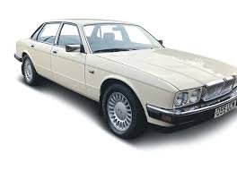 Image result for Nimbus White 1987 Jaguar