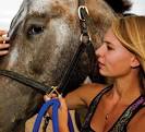 Hilary Wood, president and founder of FRER, said her organization ... - pg24-horse-hug-embed