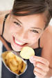 Girl eating crisps