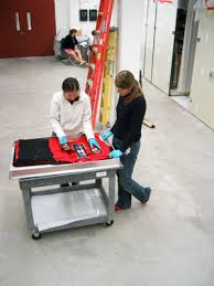 Lyazzat Khamzina and Emily Moore, 2006, examine Tlingit beadwork. Copyright UAMN. - emily_lyaka_8_2006_web1